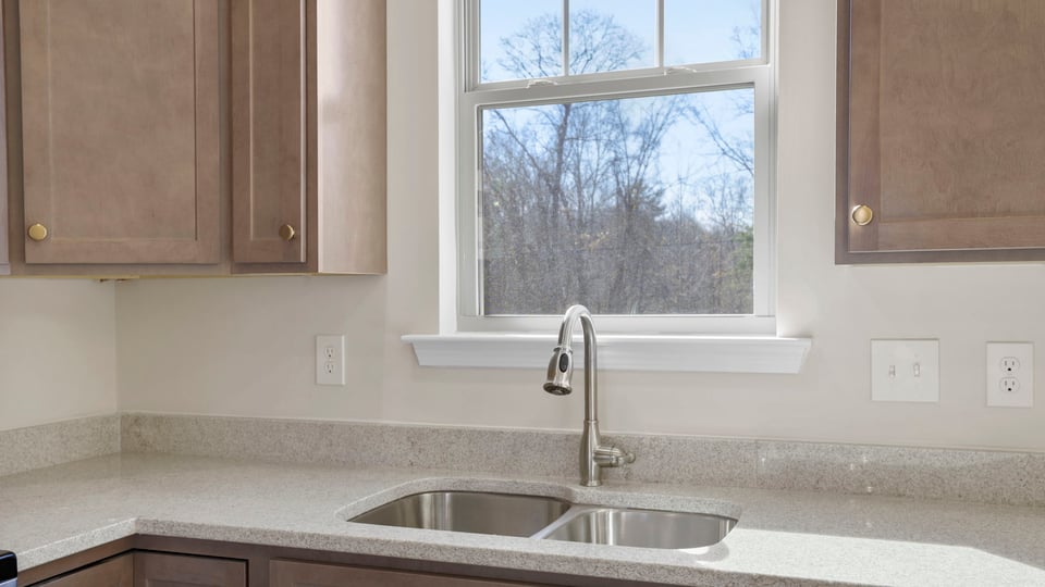 Kitchen with granite countertops and stainless steel appliances.