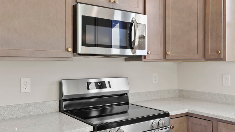 Kitchen with granite countertops and stainless steel appliances.