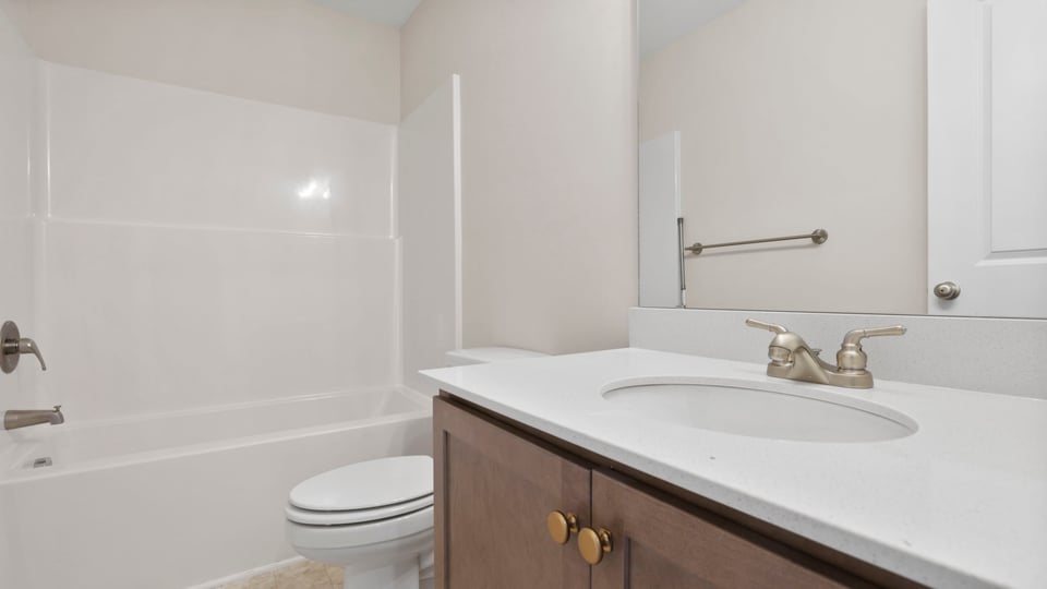 Bathroom with vanity and tub.