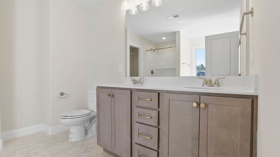 Bathroom with dual vanity.