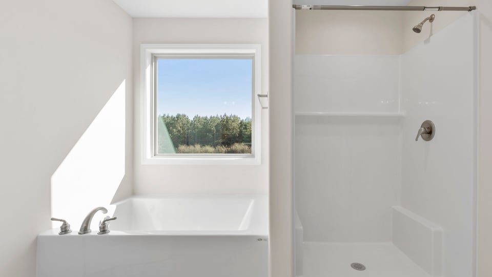 Bathroom with garden tub and walk in shower.