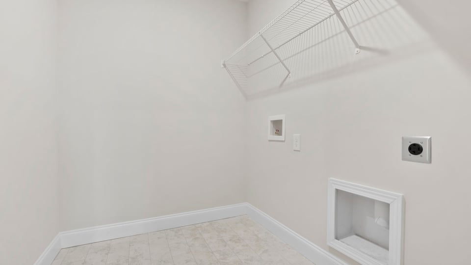 Walk in laundry with shelves.