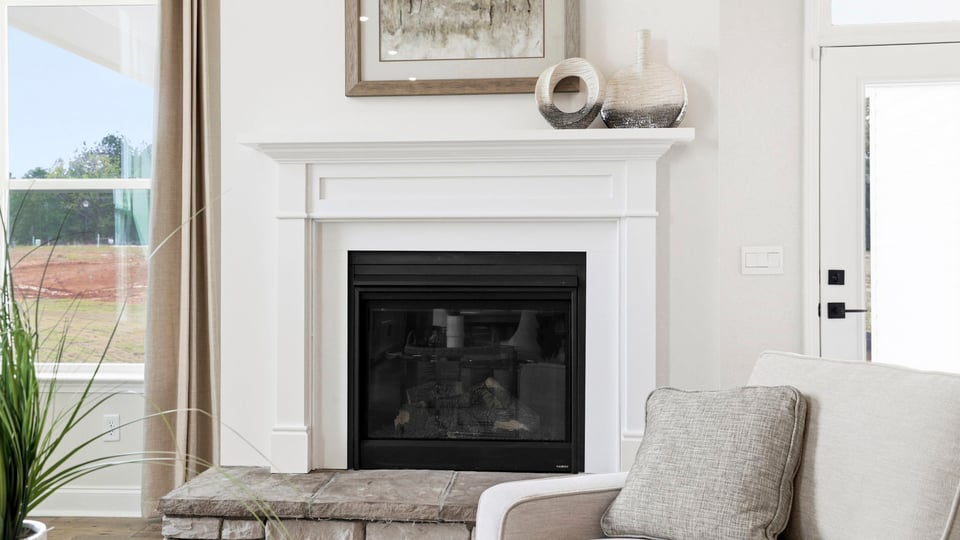 Fireplace of home with window.
