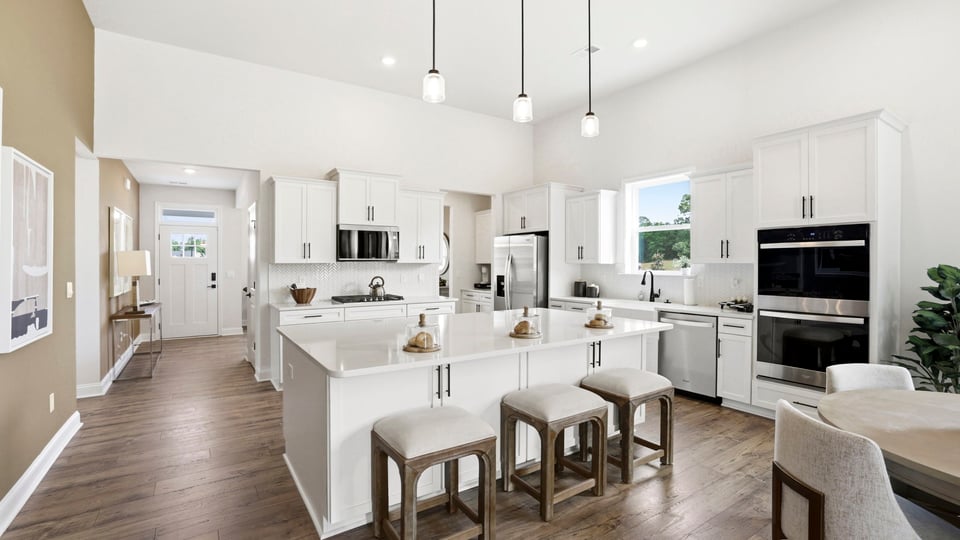 Kitchen with quartz countertops and island.