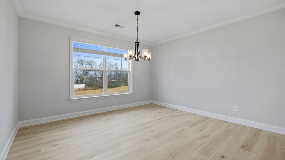 Bedroom with carpet and window.