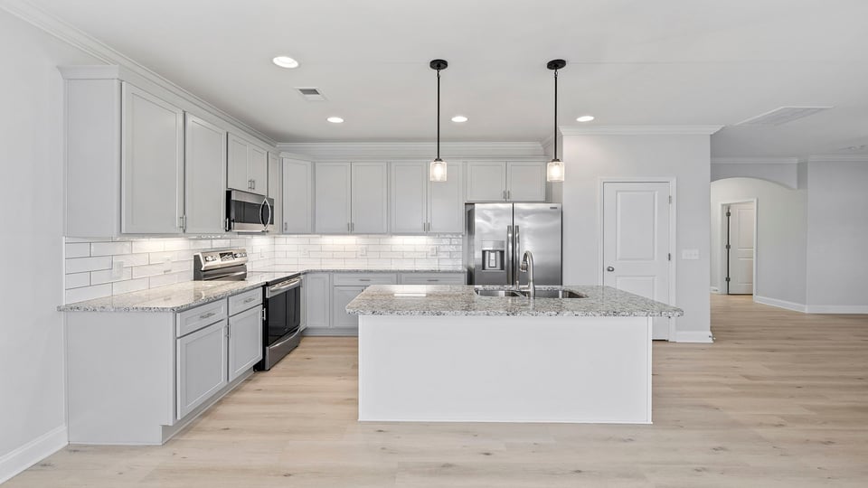 Kitchen with island and caountertops.