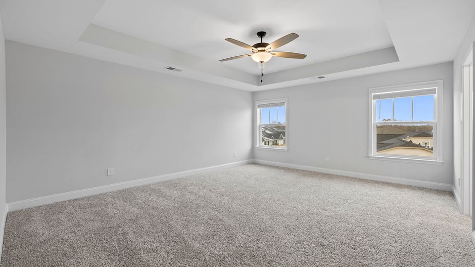 Bathroom with carpet and windows.