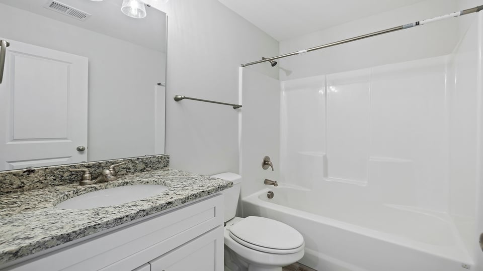 Bathroom with vanity and tub.