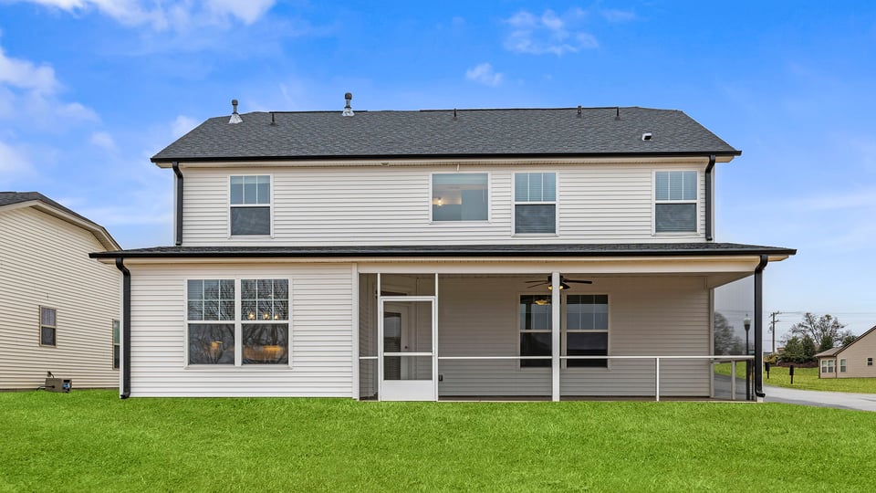 Exterior of home with large backyard.