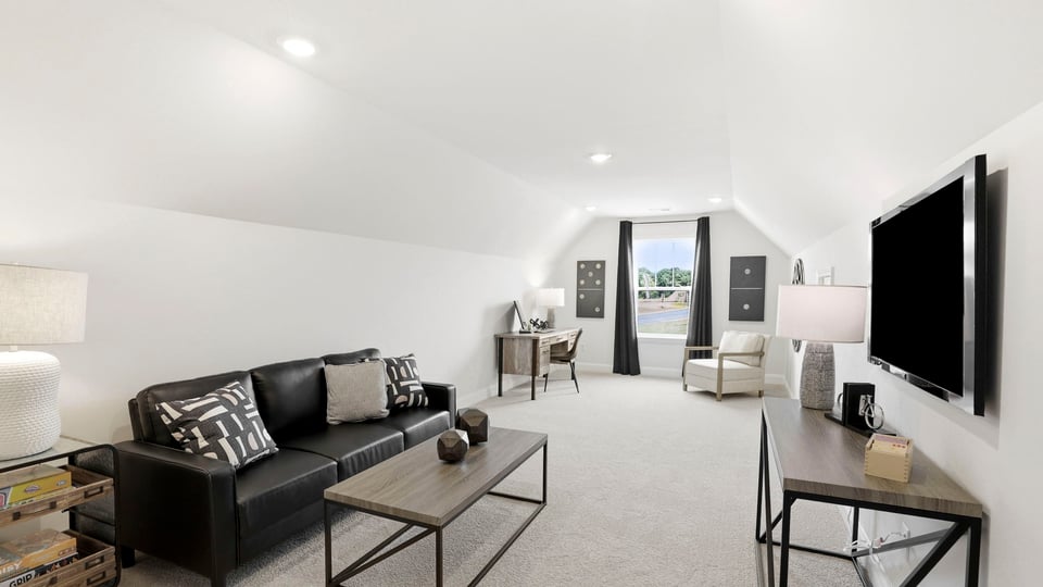 Loft with window and carpet.