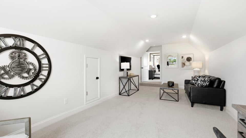 Loft with window and carpet.
