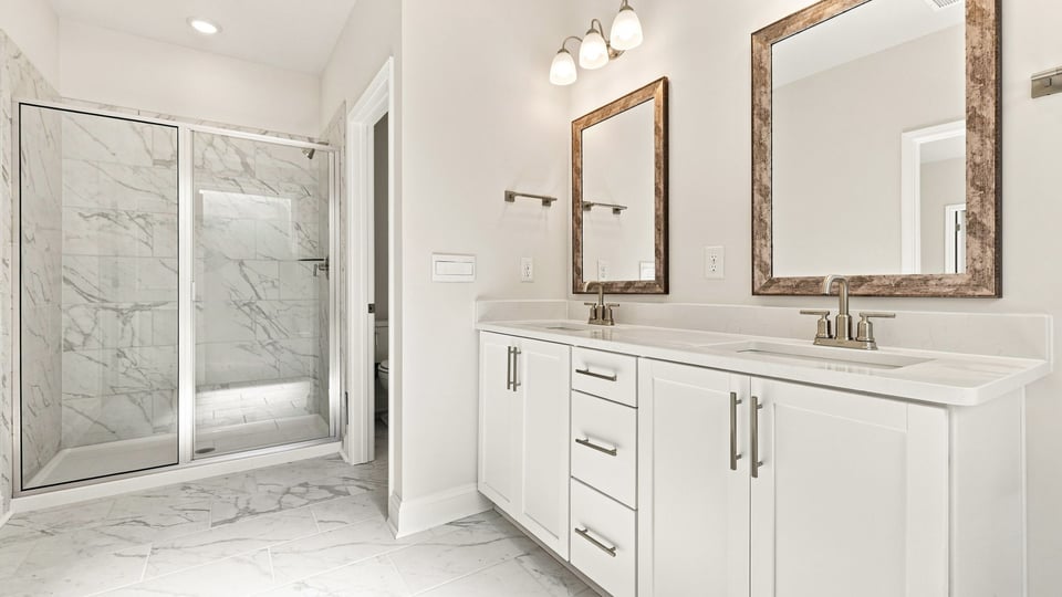 Primary bathroom with dual sink vanity.