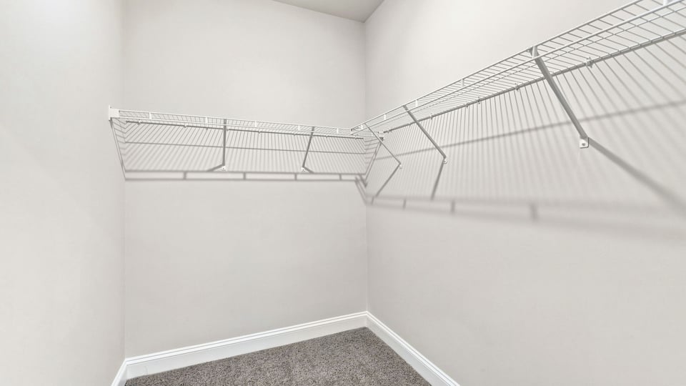 Primary bedroom walk-in closet.