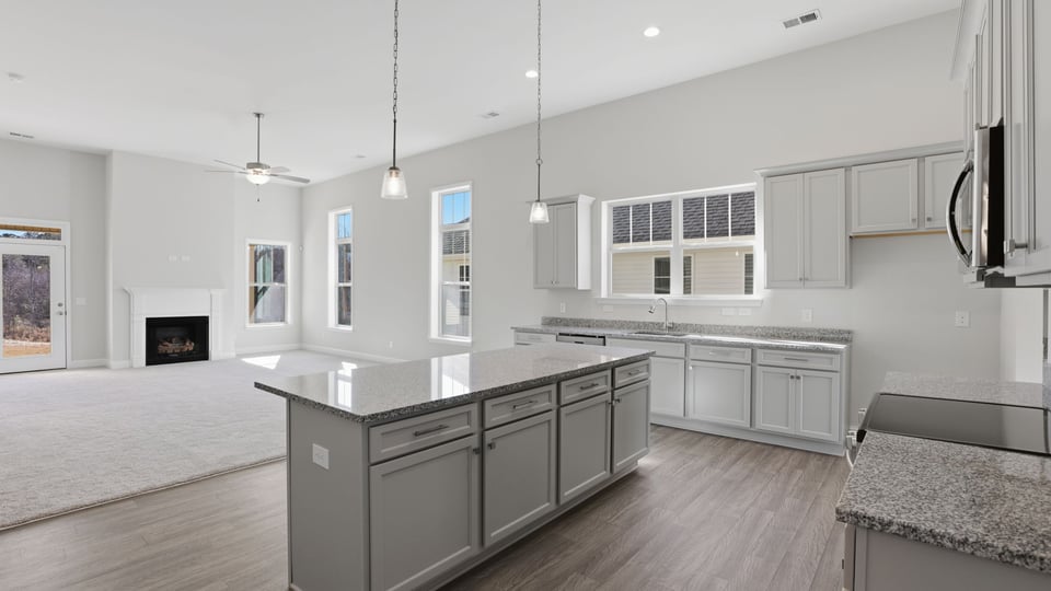 Kitchen and island with granite countertops.