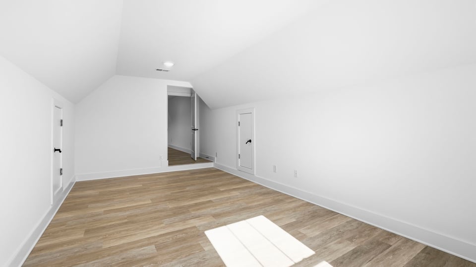Bedroom with carpet and windows.