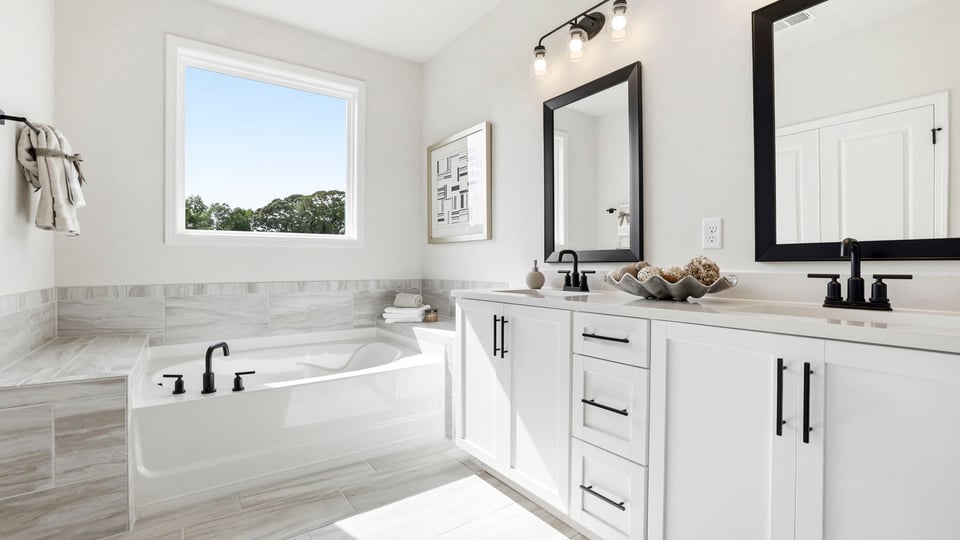 Bathroom with vanity and tub.