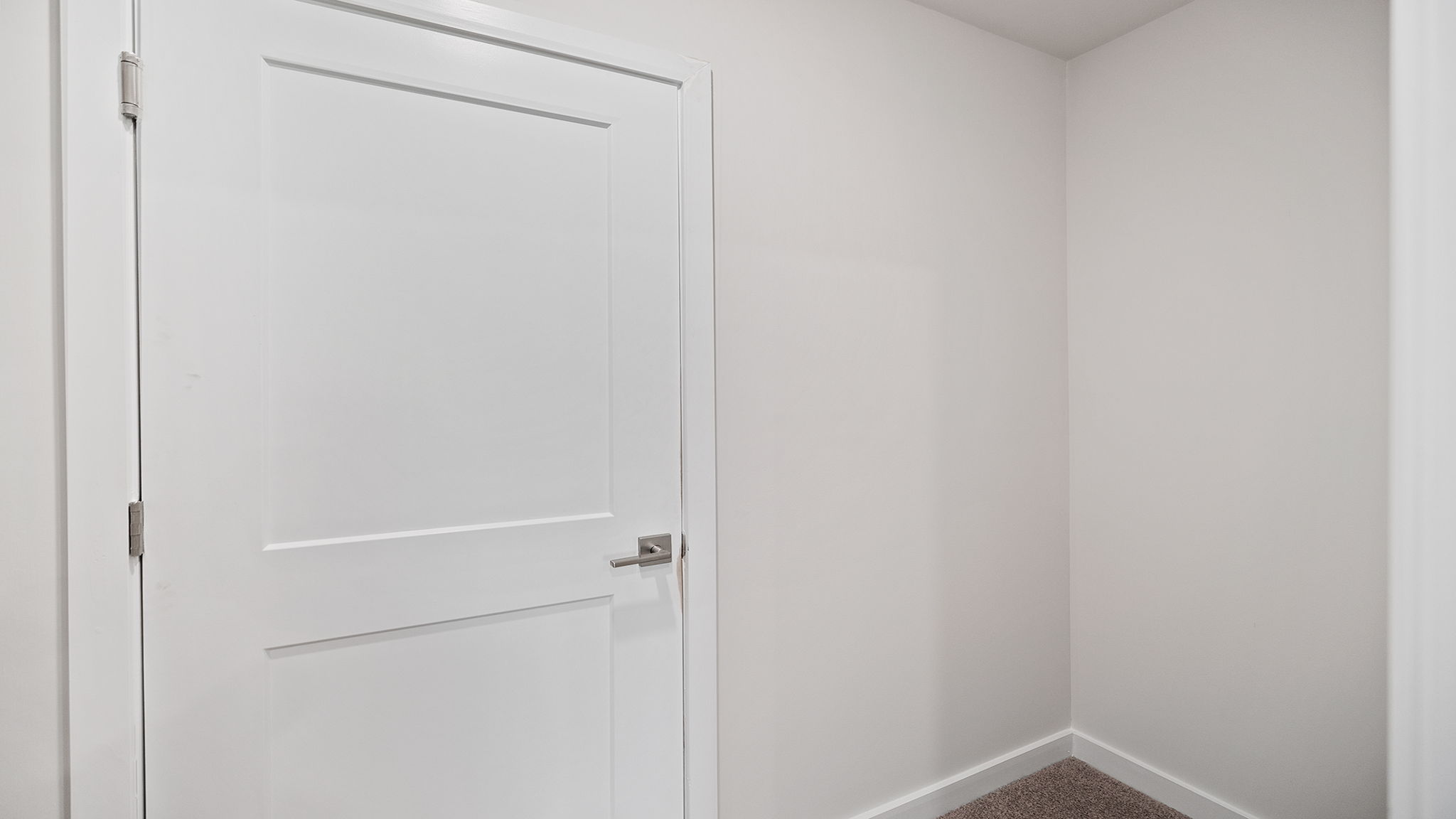Storage closet with shelf.