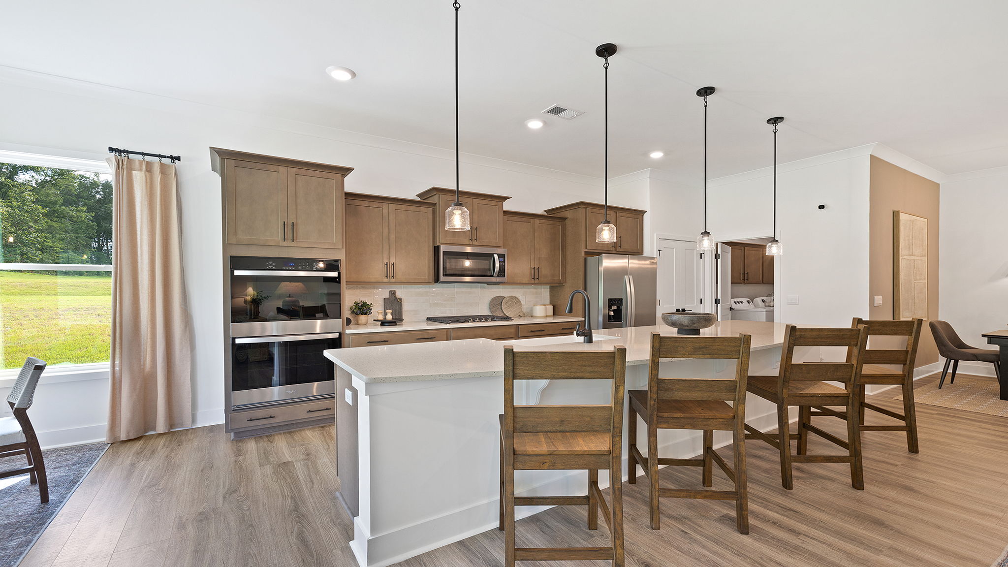 Kitchen with island and cabinets.