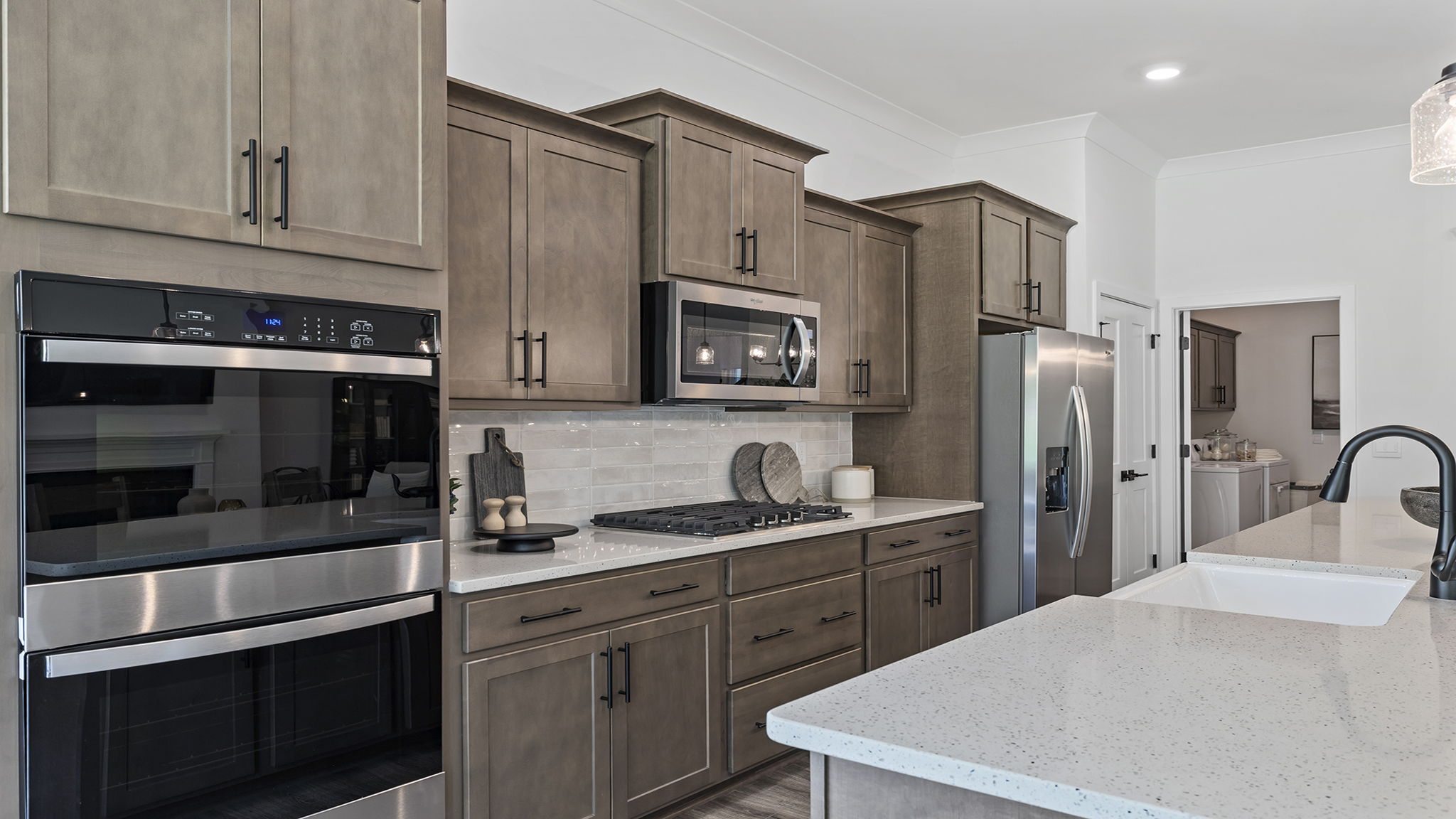 Kitchen with island and cabinets.