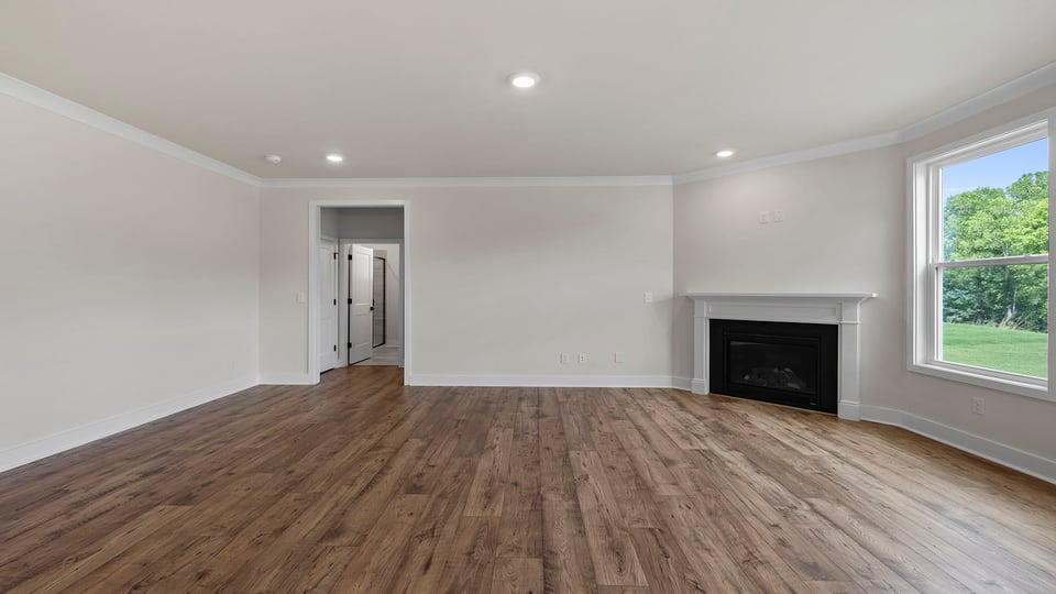 Living area with windows and fireplace.