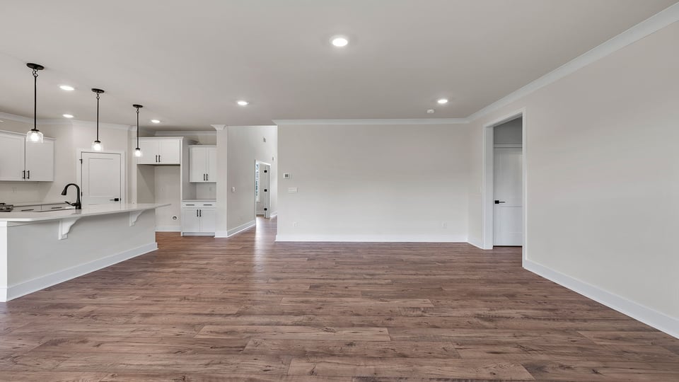 Living area with windows and fireplace.