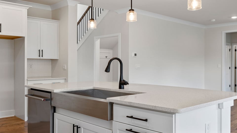 Kitchen with island and cabinets.