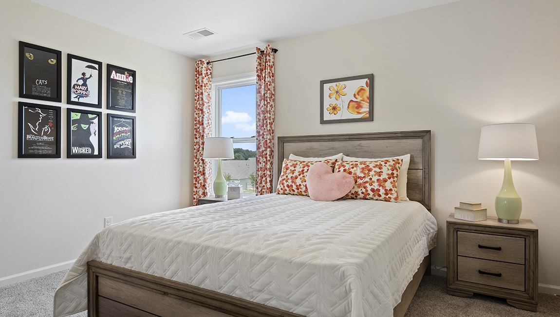 Bedroom with carpet and window.
