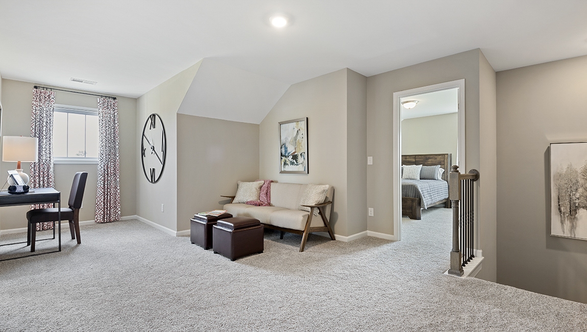 Loft area with carpet.