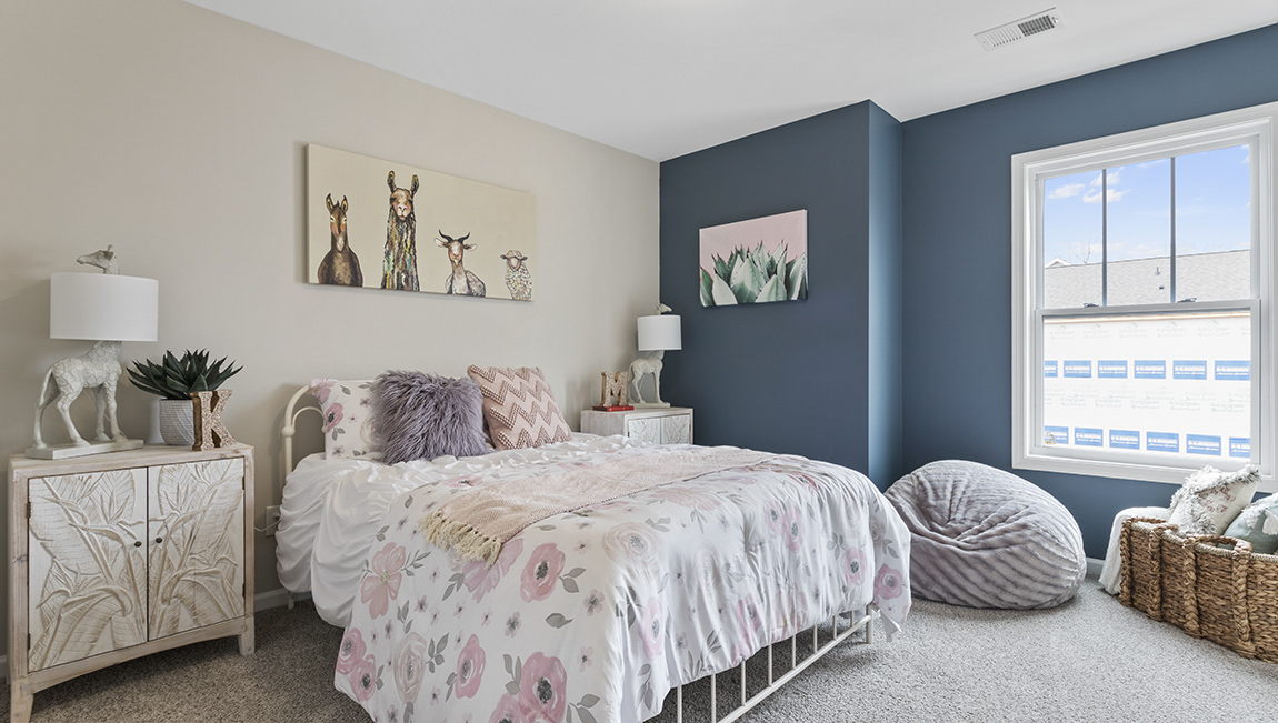 Bedroom with carpet and window.