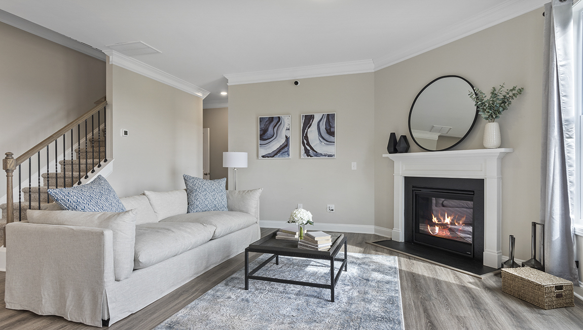 Living area with fireplace and windows.