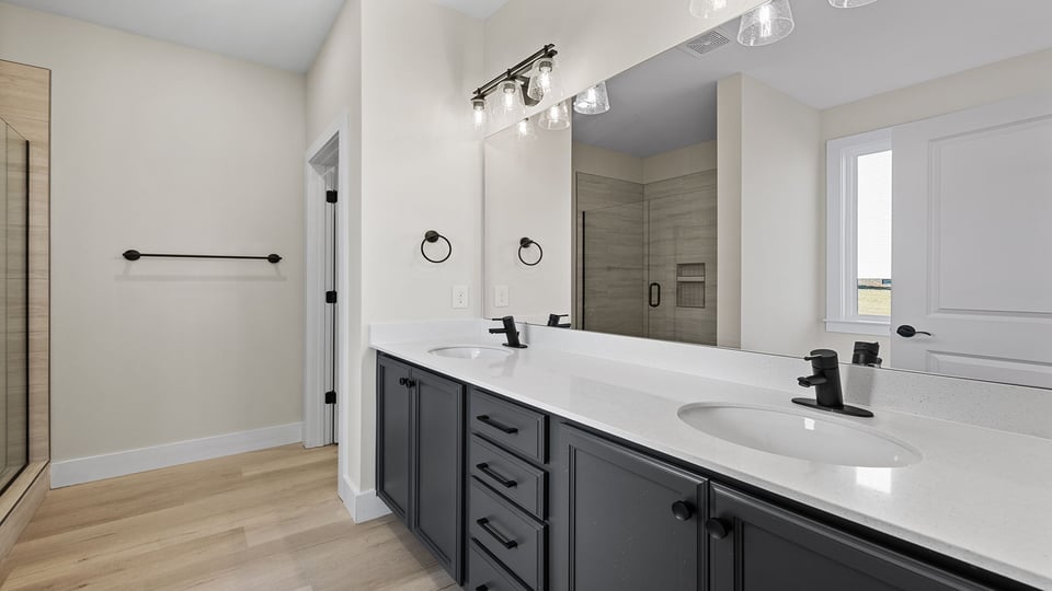 Primary bathroom with dual sink vanity.