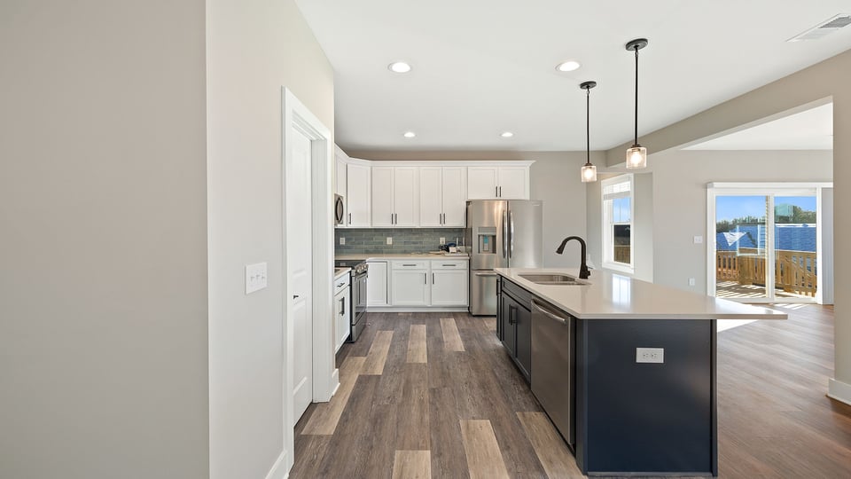 Kitchen with island and cabinets.