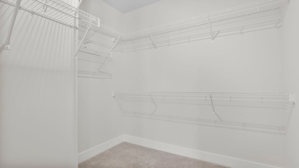 Primary bedroom walk-in closet.