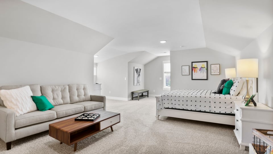 Loft with carpet and windows.