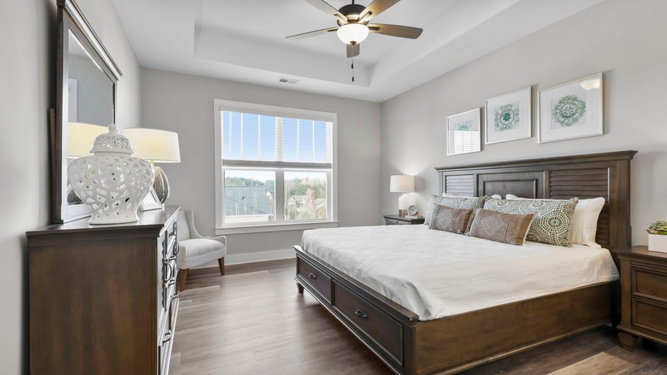 Primary bedroom with closet and window.