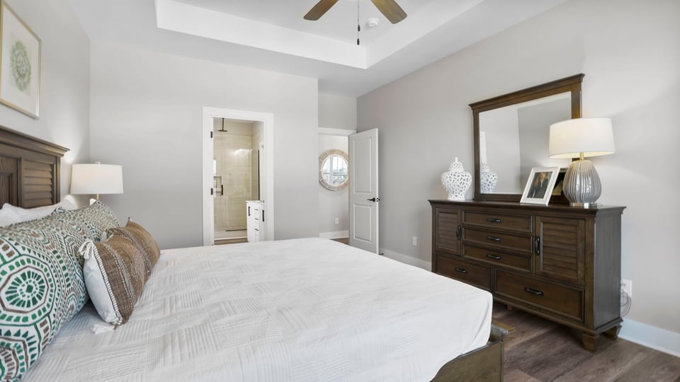 Primary bedroom with closet and window.