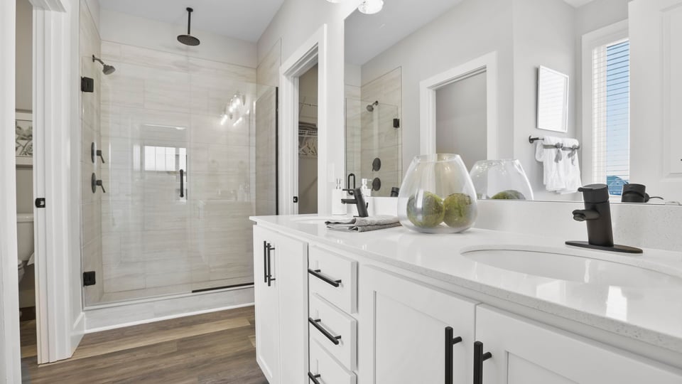 Primary bathroom with double vanity sinks.