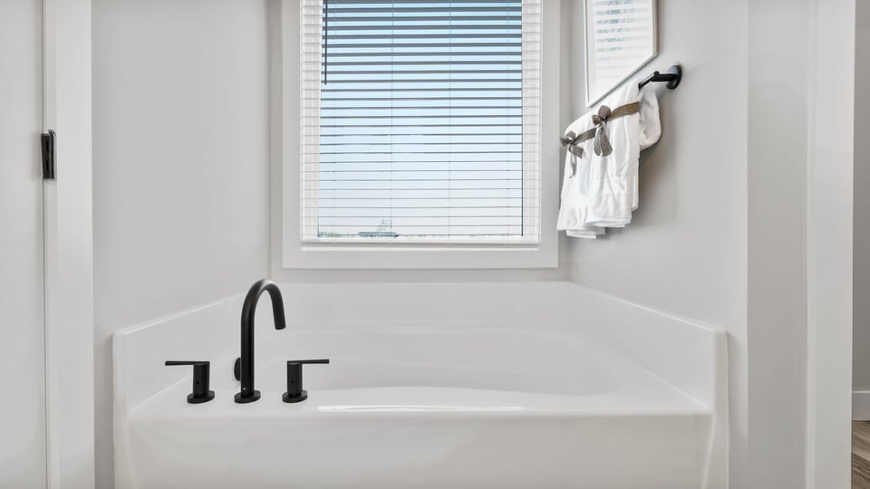 Primary bathroom with double vanity sinks.