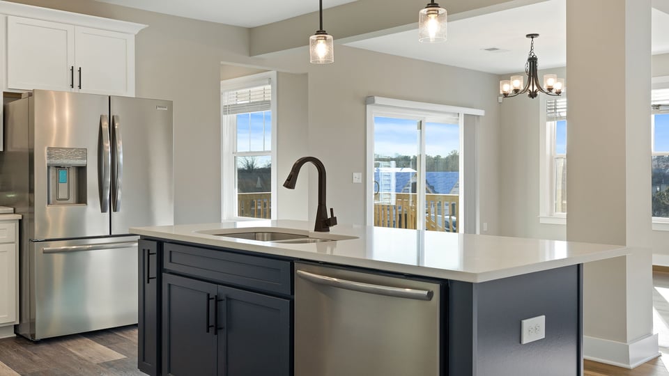 Kitchen with island and cabinets.