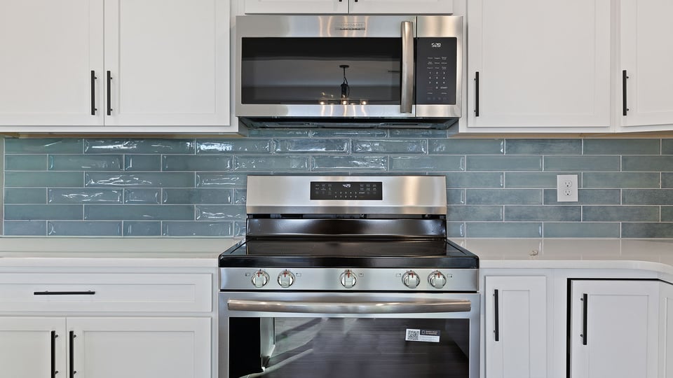 Kitchen with island and cabinets.