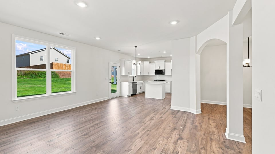 Living area with windows and fireplace.