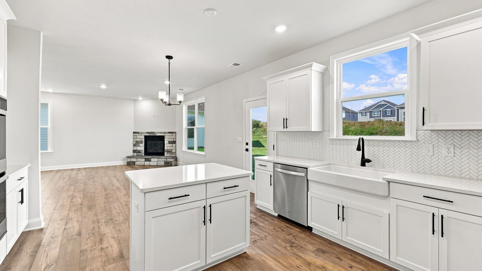 Kitchen with island and cabinets.