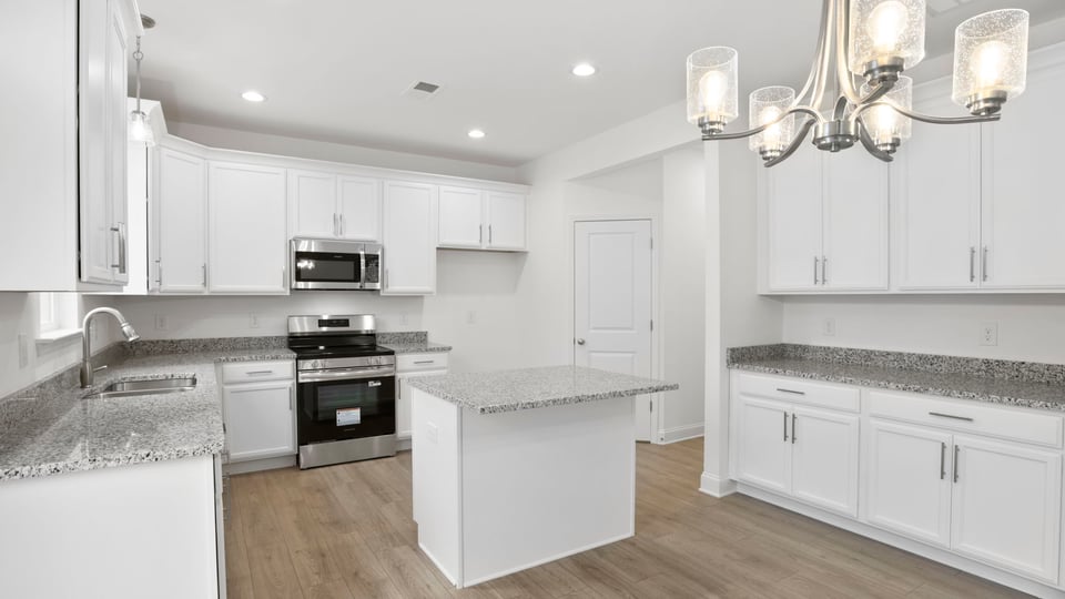 Kitchen with island and fireplace.
