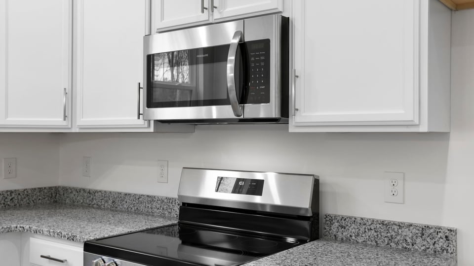 Kitchen with island and fireplace.