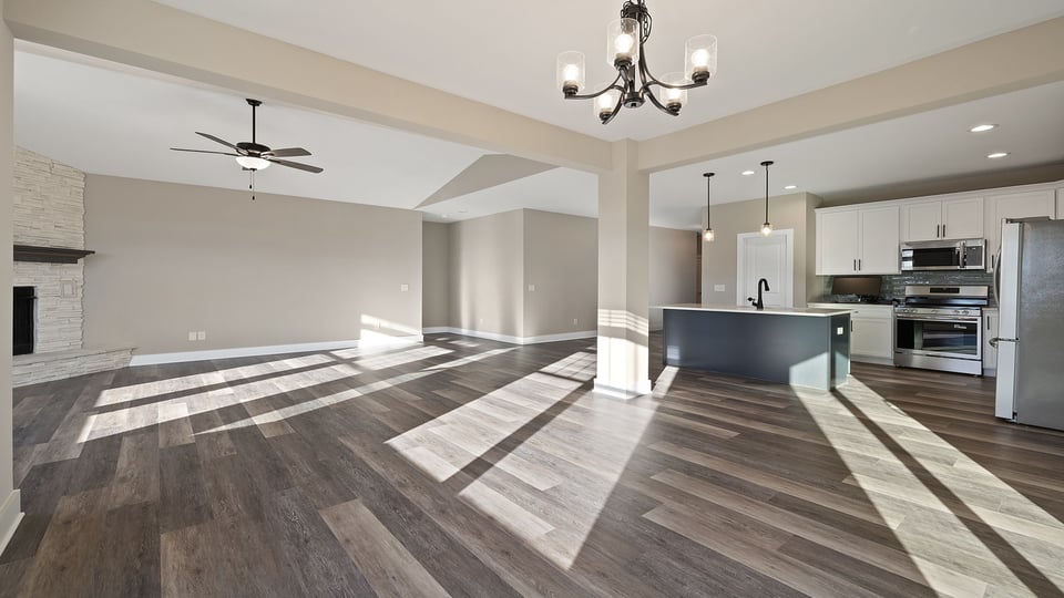 Living room with fireplace and windows.