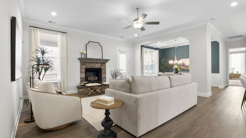 Living area with fireplace and windows.