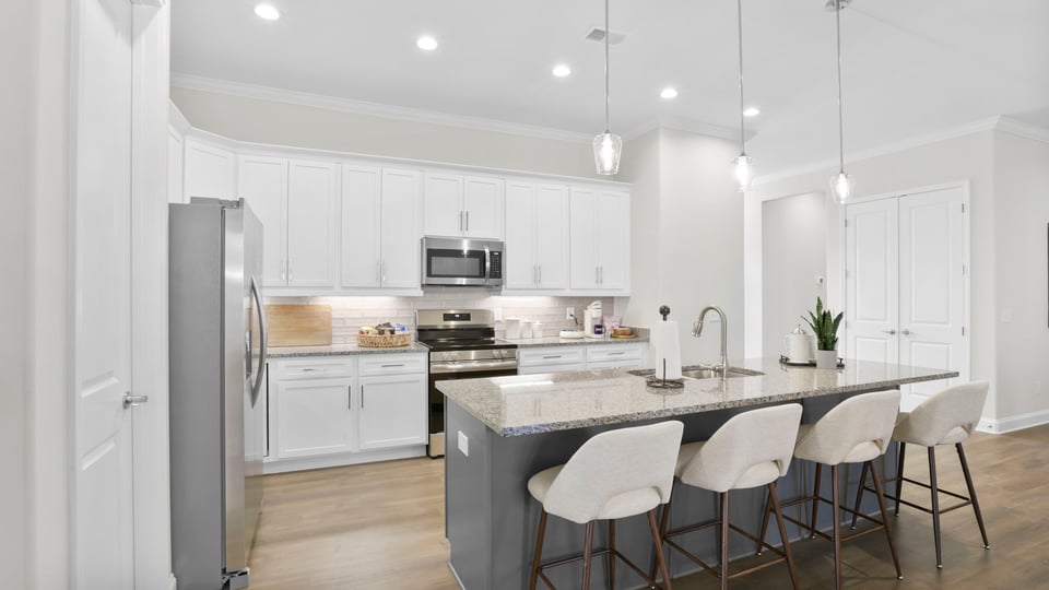 Kitchen with island and cabinets.