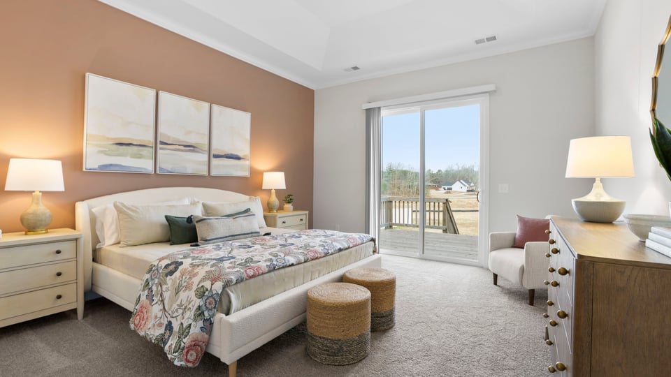 Bedroom with carpet and window.