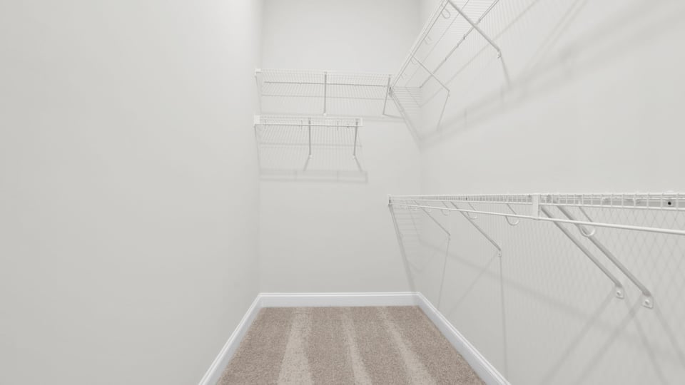 Primary closet with shelf.