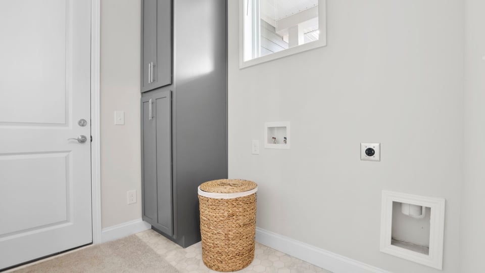 Laundry room with shelf.